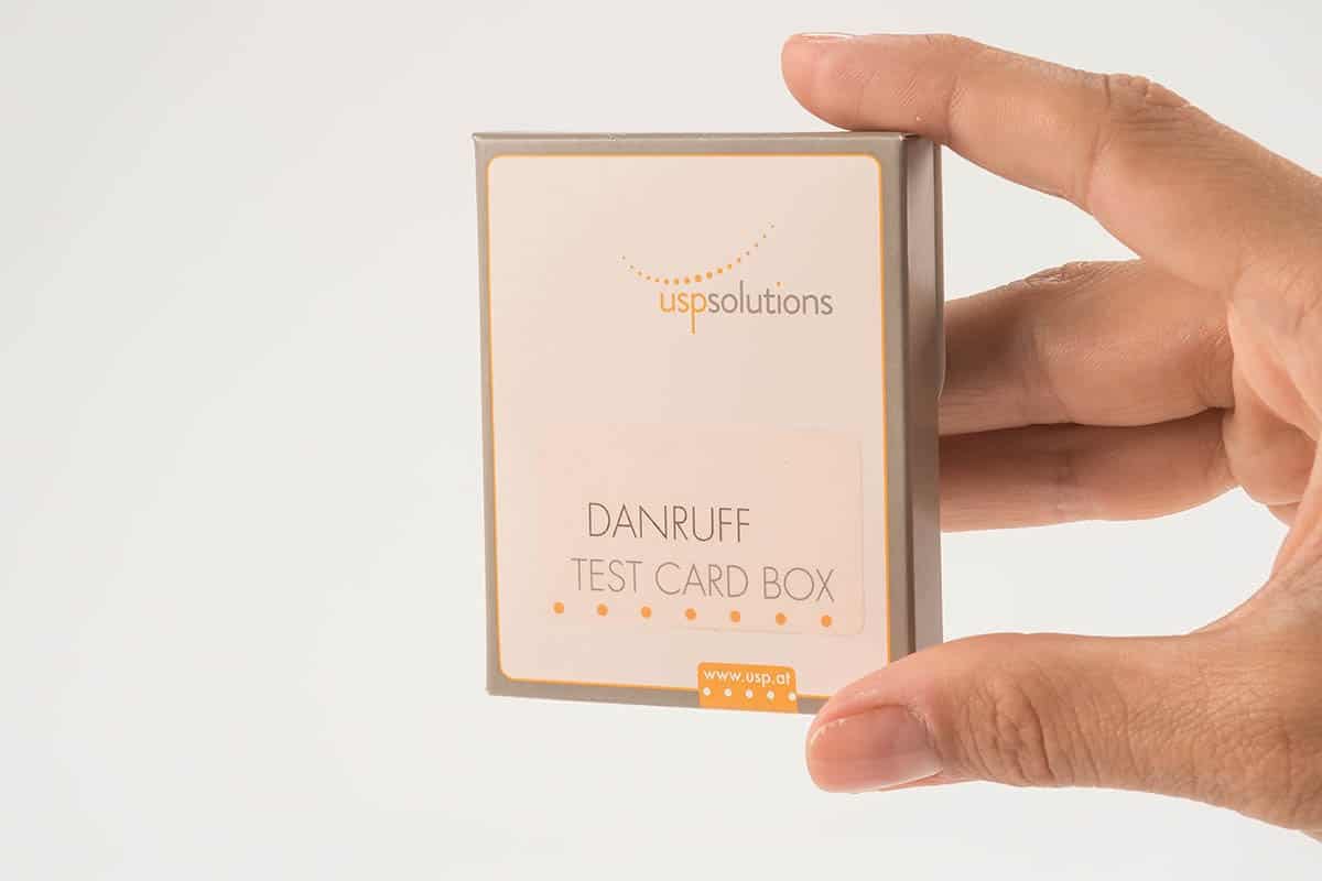 Dandruff Test Card Box held in Hand | USP Solutions